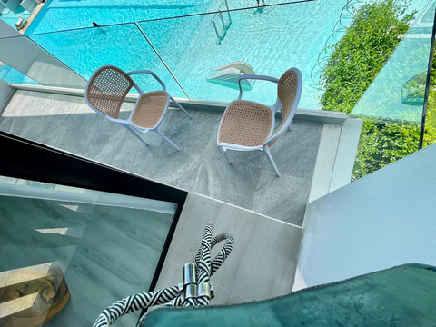 Tropical pool with palm trees at Villa Q1, Replay Residence Bangrak Koh Samui