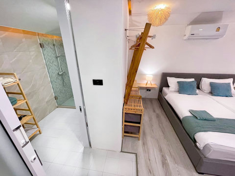 Colorful bedroom with teal accents and LED lighting at Villa Q1, Koh Samui