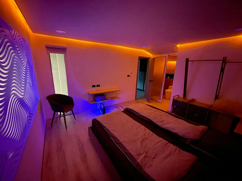 Sleek modern interior with staircase at Villa Q1, Replay Residence Bangrak