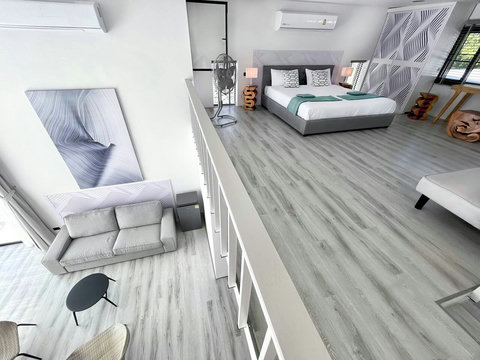 Designer bedroom with vibrant LED mood lighting at Villa Q1, Koh Samui Thailand