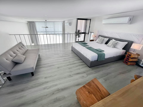 Neutral-toned bedroom with cushions at Villa Q1, Koh Samui holiday rental