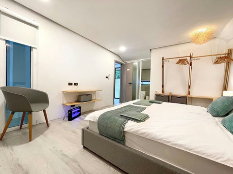 Green teal bedroom with modern furnishings at Villa Q1, Replay Residence Koh Samui