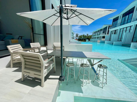 Poolside terrace with glass railing at Villa Q1, Koh Samui Thailand