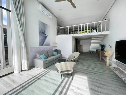 Open-plan living room with high ceilings at Villa Q1, Replay Residence Koh Samui