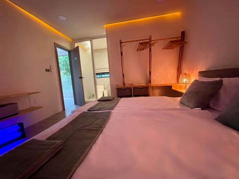 Modern bedroom with teal accents at Villa Q1, Bangrak Koh Samui Thailand