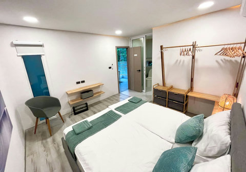 Bedroom with turquoise decor at Villa Q1, Koh Samui vacation rental