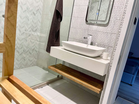 Spacious bathroom with double vanity sink at Villa Q1, Replay Residence Bangrak Koh Samui