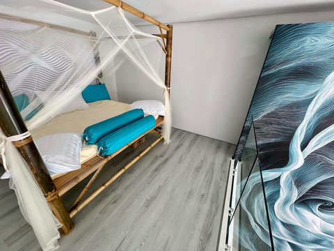 Bedroom with turquoise bedding at Villa Q1, Koh Samui luxury vacation home