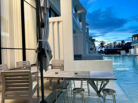Beachfront terrace with day beds at Villa Q1, Replay Residence Koh Samui