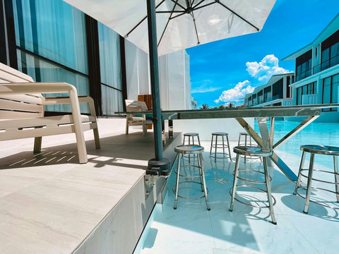 Outdoor dining terrace with ocean view at Villa Q1, Replay Residence Koh Samui