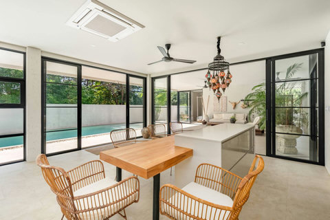 Open-plan living and dining area with garden views