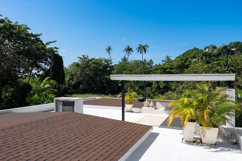 Aerial view of villa with pool terrace and tiled roof