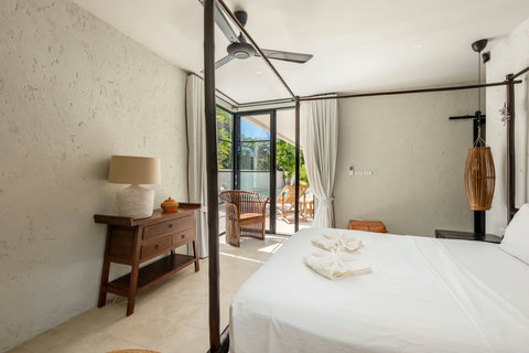 Charming master bedroom with traditional wooden four-poster bed