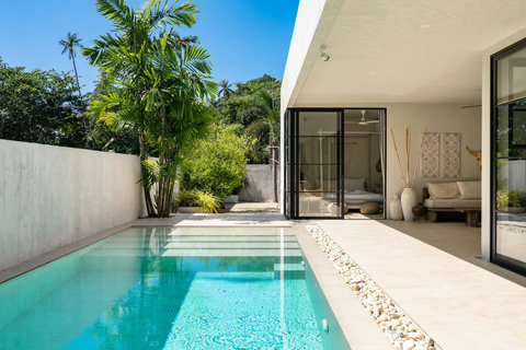 Outdoor terrace overlooking the pool and garden
