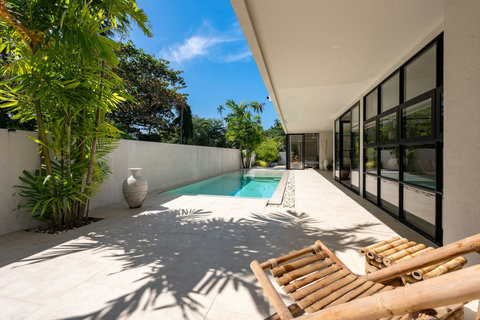 Relaxing poolside lounge with sun chairs