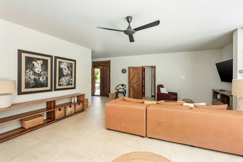 indoor living area with wooden table and rattan seating