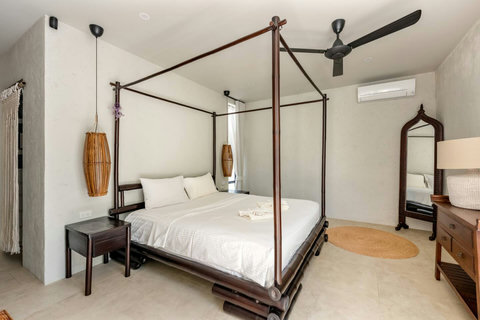 Family-friendly room with king beds and privacy curtains