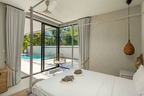 Wake Up to Pool Views in a Stylish Tropical Bedroom