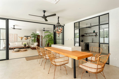 Open-plan kitchen and dining with hanging plants