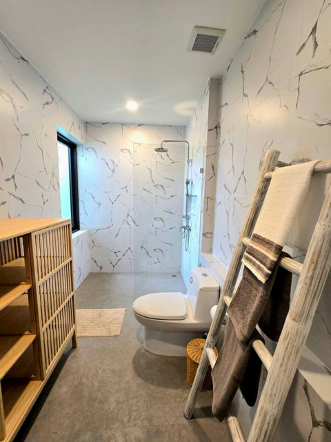 Sitting area with blue accent walls and balcony access
