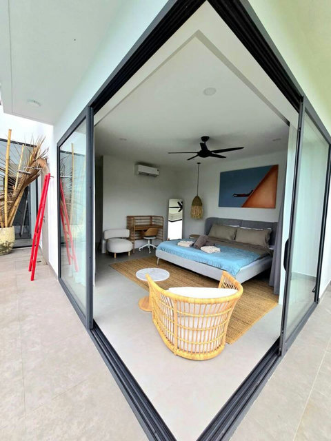 Tropical-style room with natural bamboo and rattan accents