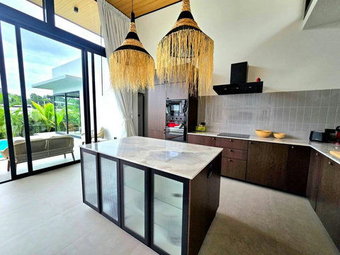 Modern kitchen with island counter and scenic window views