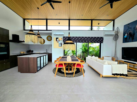 Open-concept living and dining area with vibrant decor