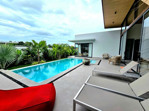 Crystal-clear pool with modern deck and loungers