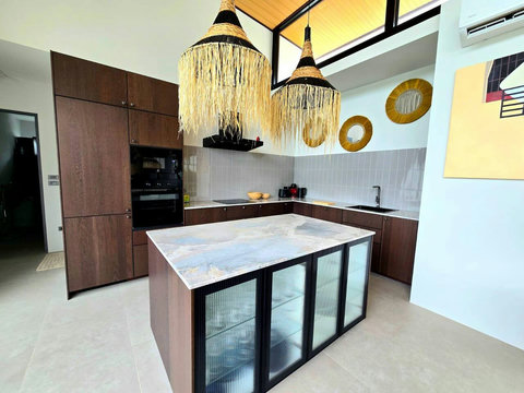 Kitchen breakfast bar with colorful seating and open-air design