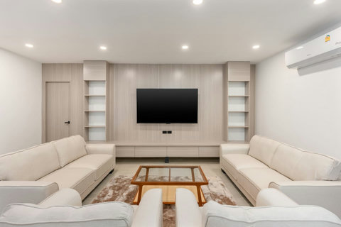 Spacious modern living room with plush sofas and minimalist decor at Koh Samui holiday villa