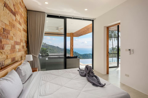 Stylish guest bedroom with garden access and tropical decor at Sunrise Hill Villa Koh Samui