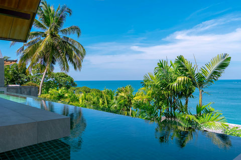 Palm-lined tropical garden with panoramic Andaman Sea views at Laemsingh Villa, Phuket