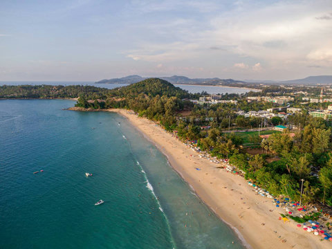 Aerial drone view of pristine Surin Beach coastline near Laemsingh Villa, Phuket Thailand