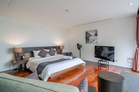 Contemporary bedroom suite with mood lighting and designer interiors at Laemsingh Villa