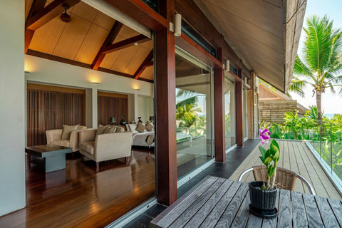 Covered outdoor living pavilion with tropical garden at Laemsingh Villa, Surin Beach Phuket