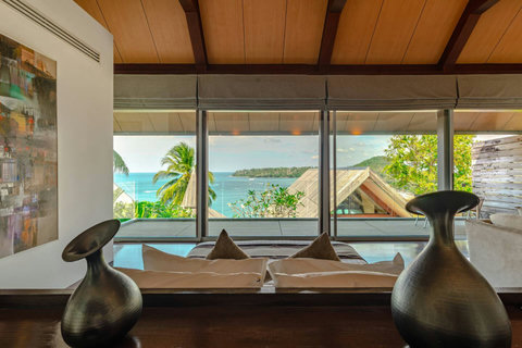 Elegant interior with rich wooden details and ocean views at Laemsingh Villa, Phuket