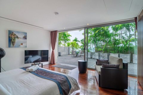 Comfortable guest bedroom with ocean-inspired decor at Laemsingh Villa, Surin Beach Phuket