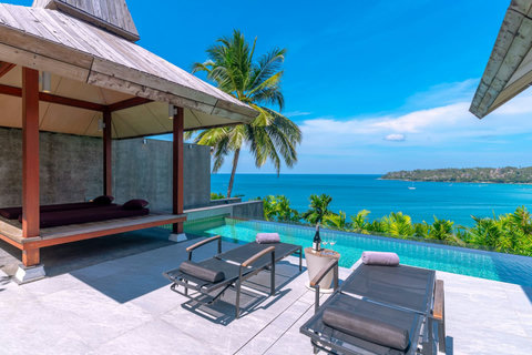 Secluded tropical bay with crystal-clear waters near Laemsingh Villa, Surin Beach Phuket
