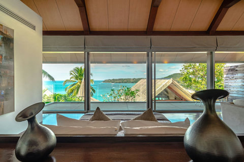 Glass-walled living pavilion with uninterrupted ocean views at Laemsingh Villa, Phuket