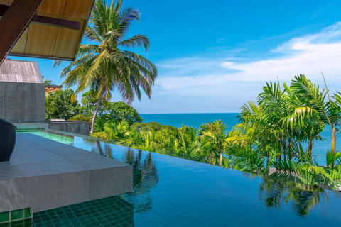 Golden sunset over the bay and coastline near Laemsingh Villa, Surin Beach Phuket