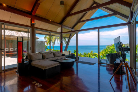 Thatched-roof pavilion with garden and pool views at Laemsingh Villa, Surin Beach Phuket