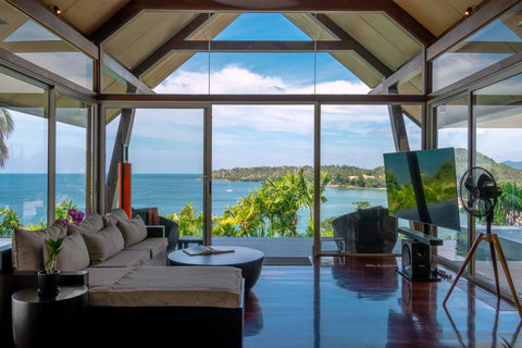Spacious open-air living pavilion with wooden ceiling and Andaman Sea views, Laemsingh Villa Phuket