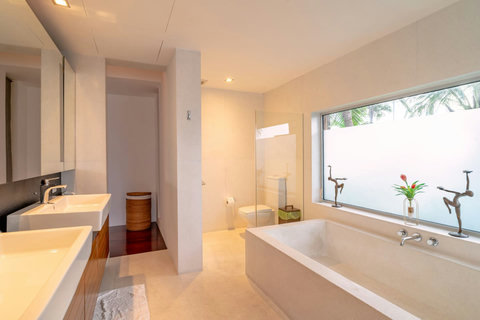 Elegant hallway with contemporary design and natural materials at Laemsingh Villa, Phuket