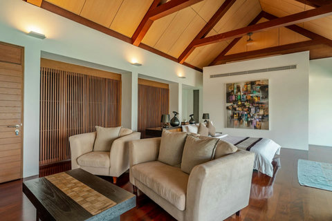 Cozy living room with plush seating and warm ambiance at Laemsingh Villa, Phuket