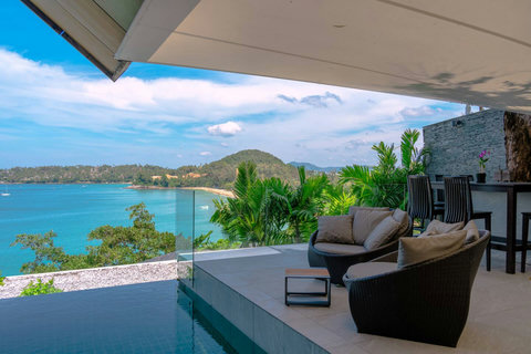 Sun loungers by the private pool with unobstructed sea views at Laemsingh Villa, Phuket