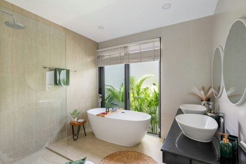 Freestanding soaking bathtub with garden view at Villa Solunara, Koh Samui Thailand