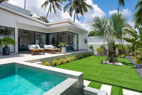 Covered outdoor living area with pool and garden view at Villa Solunara, Koh Samui rental