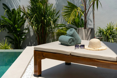 Sink into the poolside daybed and drift away with garden views and a gentle breeze.