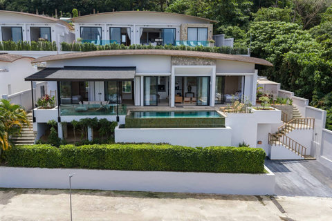 Contemporary multi-level villa architecture with panoramic mountain views in Koh Samui