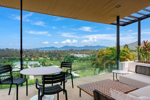 Covered outdoor lounge terrace with sea views, perfect for relaxing at Villa Ombra Koh Samui